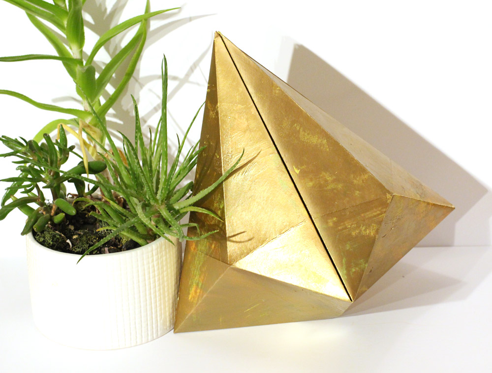 gold paper bell decoration with succulent